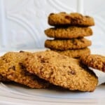 oat flour cookies in a stack on a white plate.