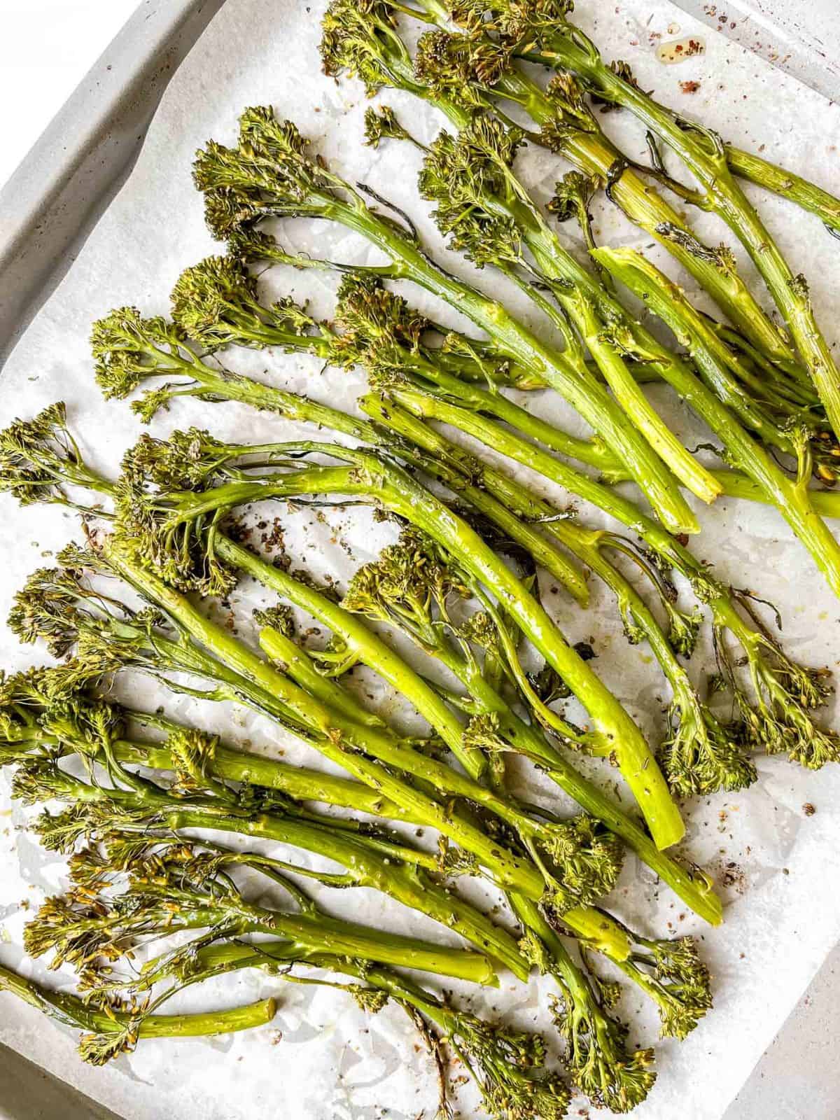 tenderstem broccoli on a lined baking tray.