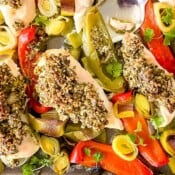 pesto chicken and vegetables on a sheet pan.