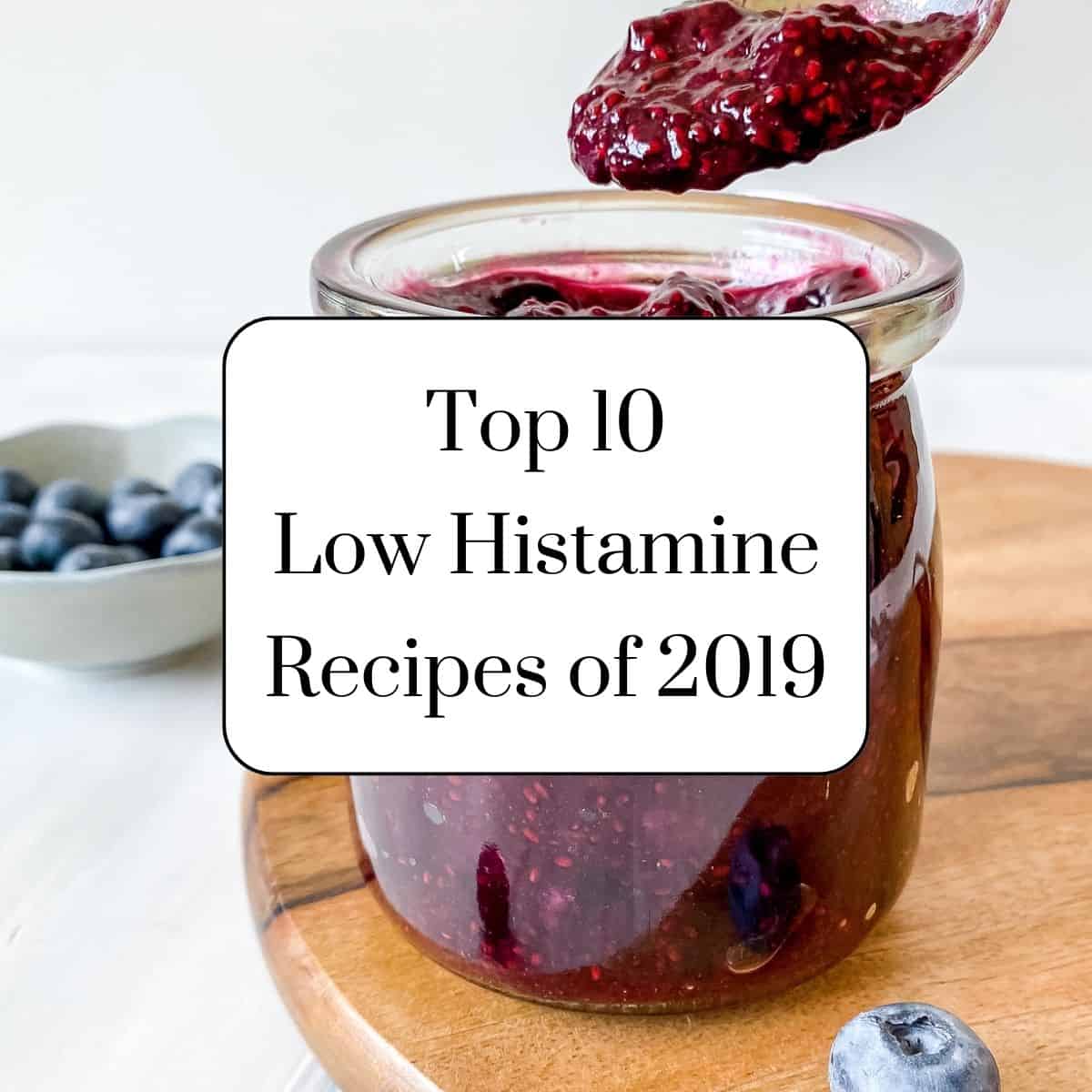 blueberry chia jam in a glass jar with text, top ten low histamine recipes of 2019.