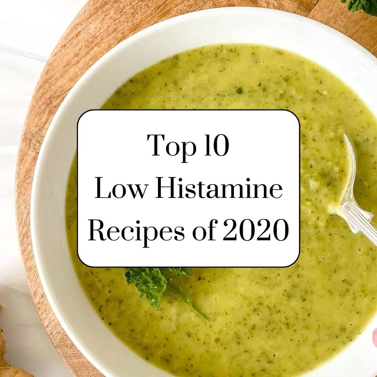bowl of green soup in a white bowl with text, top ten low histamine recipes of 2020.