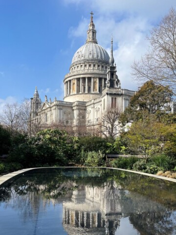 St Paul's cathedral and a pond in a garden.