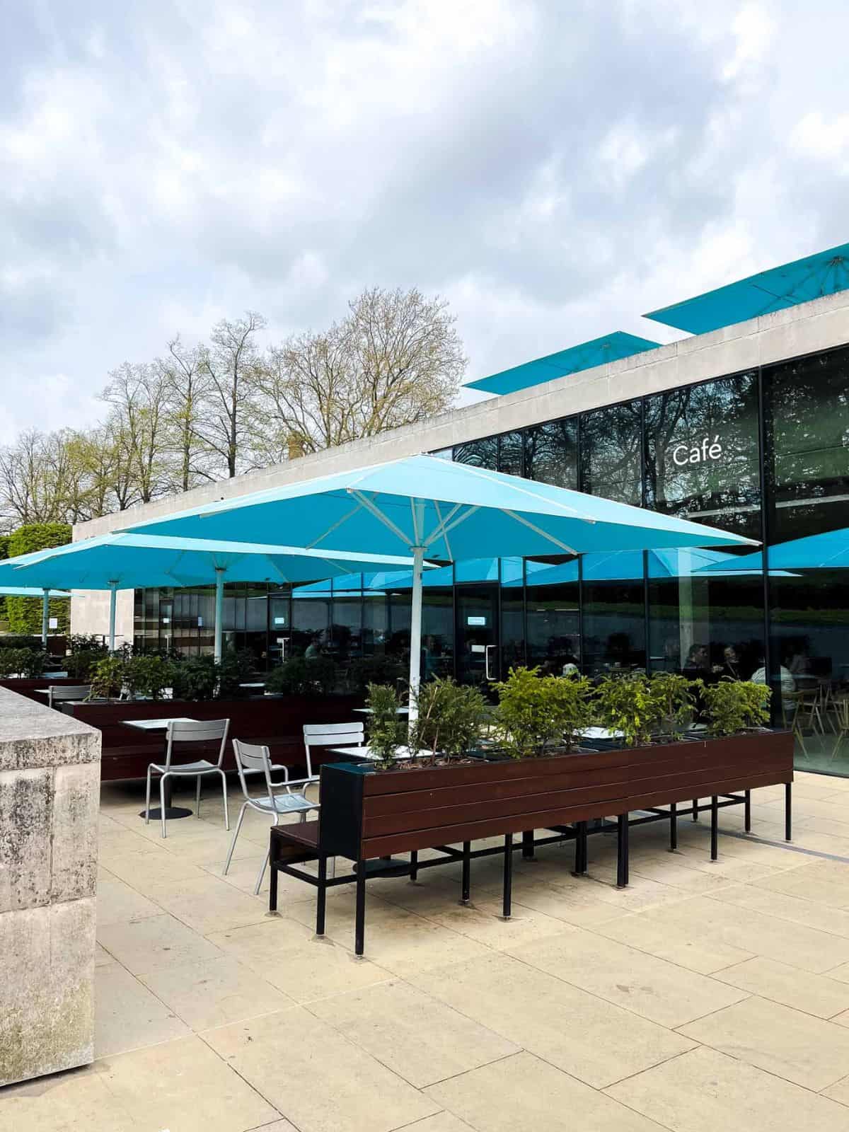 outdoor cafe with blue umbrellas.