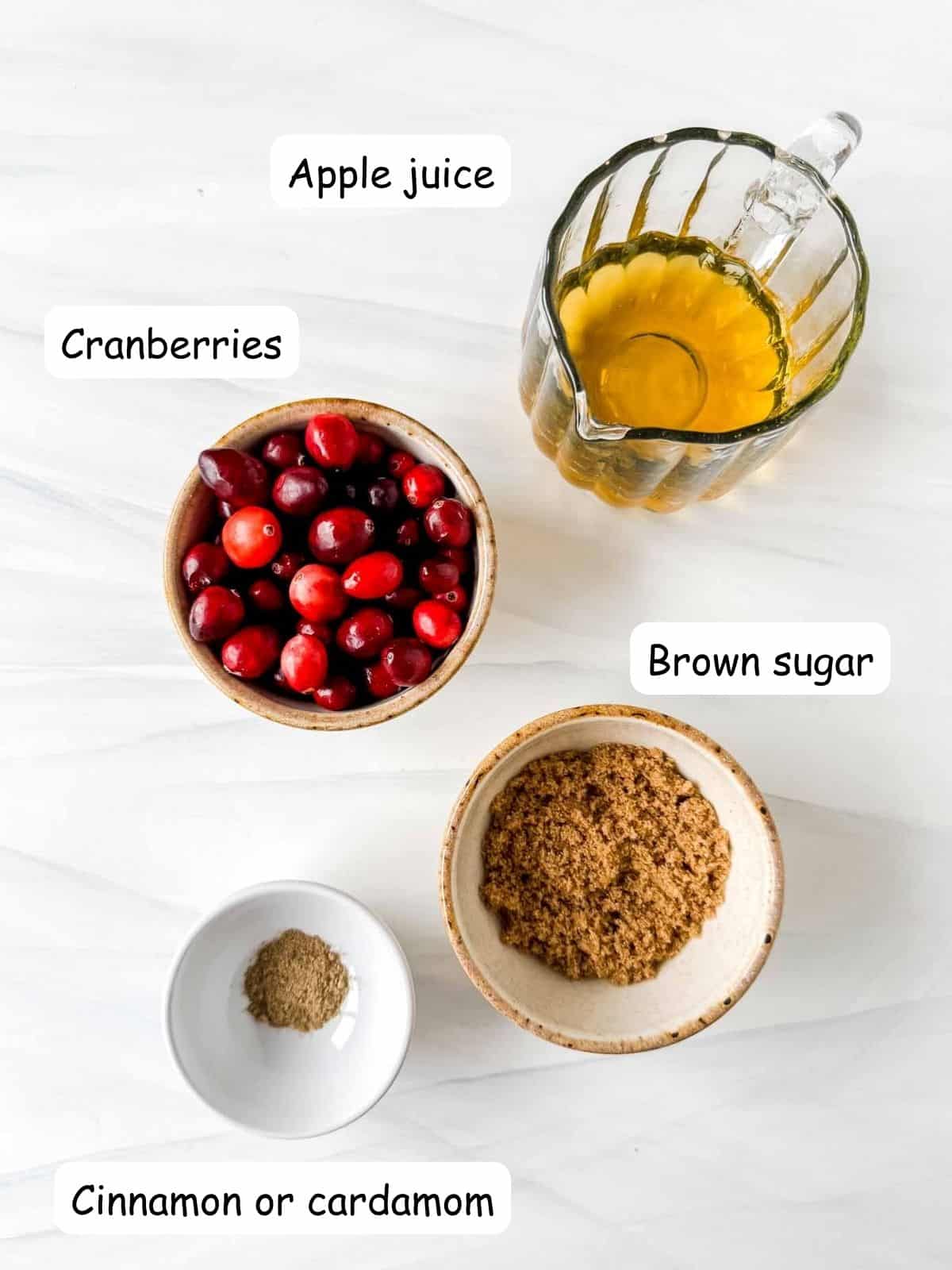 individually labelled cranberries, apple juice, brown sugar and cinnamon or cardamom.