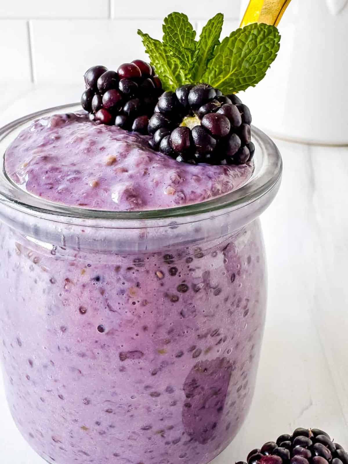 blackberry chia pudding in a glass jar.