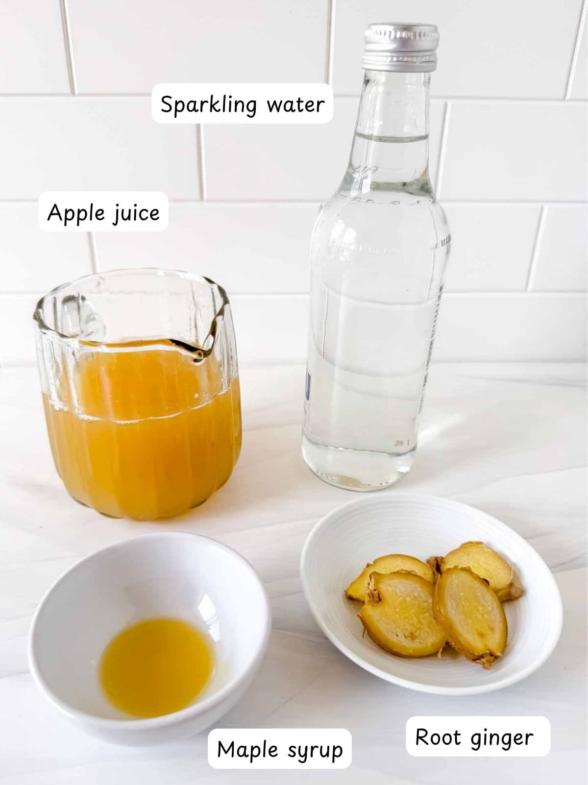 individually labelled apple juice, maple syrup, root ginger and sparkling water.