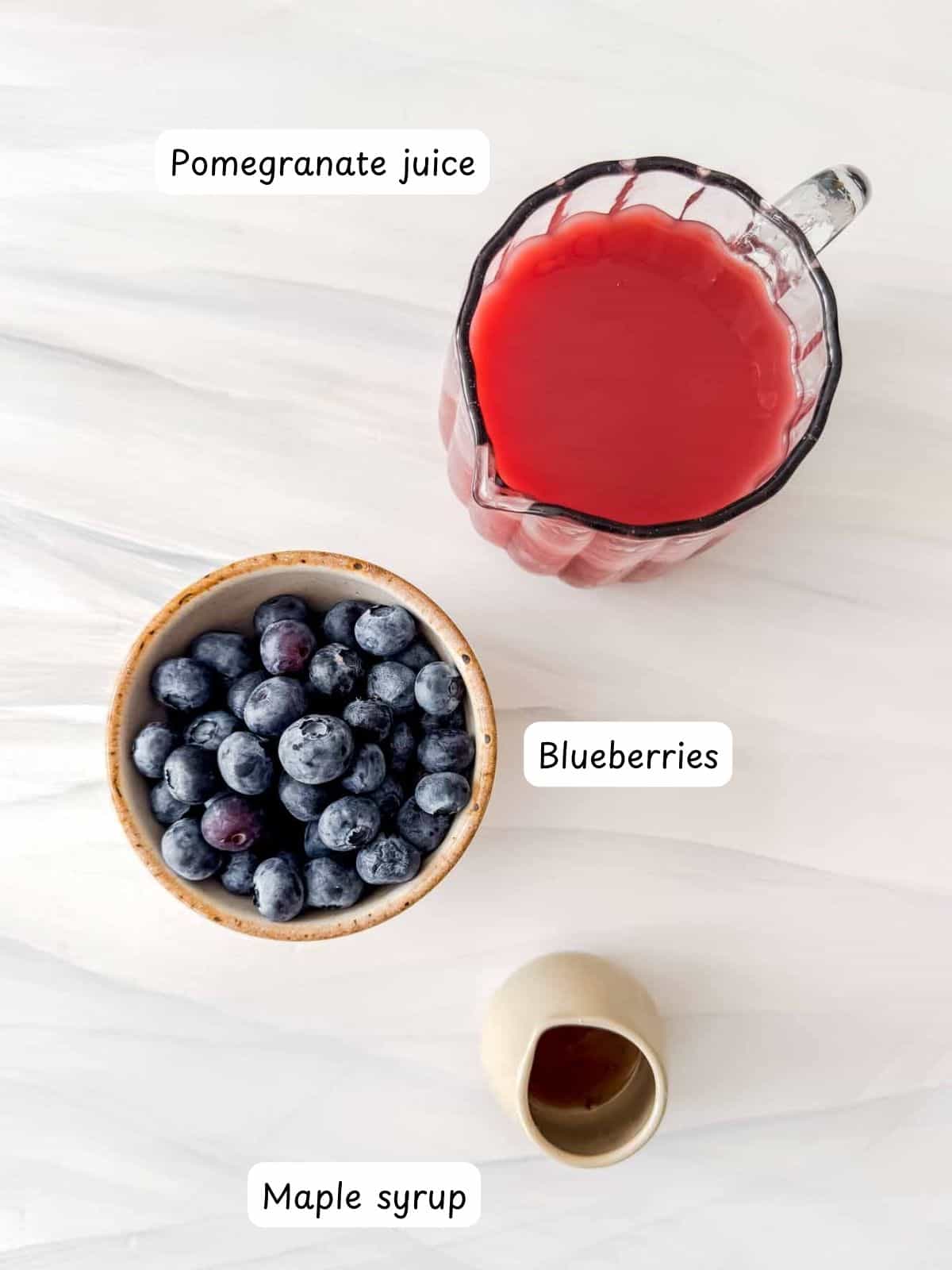 individually labelled pomegranate juice, blueberries and maple syrup.