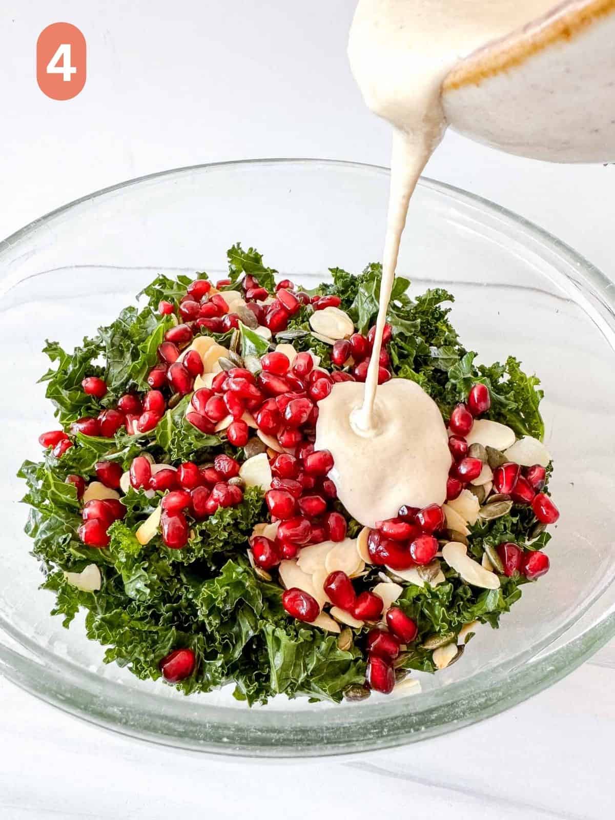 kale, pomegranate seeds, nuts and seeds in a glass bowl with tahini dressing being poured onto it, labelled number four.