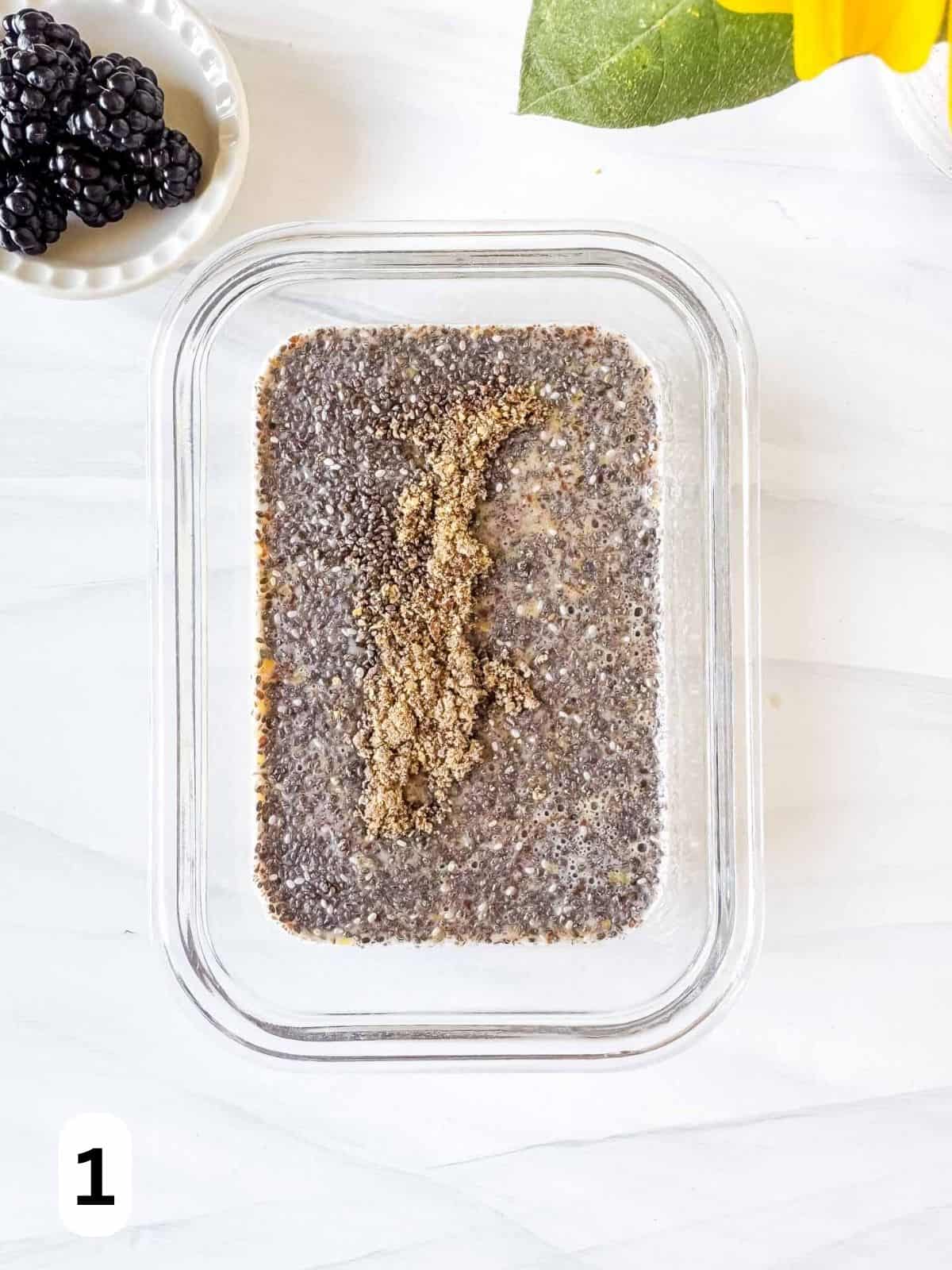 chia seeds, ground flaxseed, plant milk and cardamom in a glass dish labelled number one.