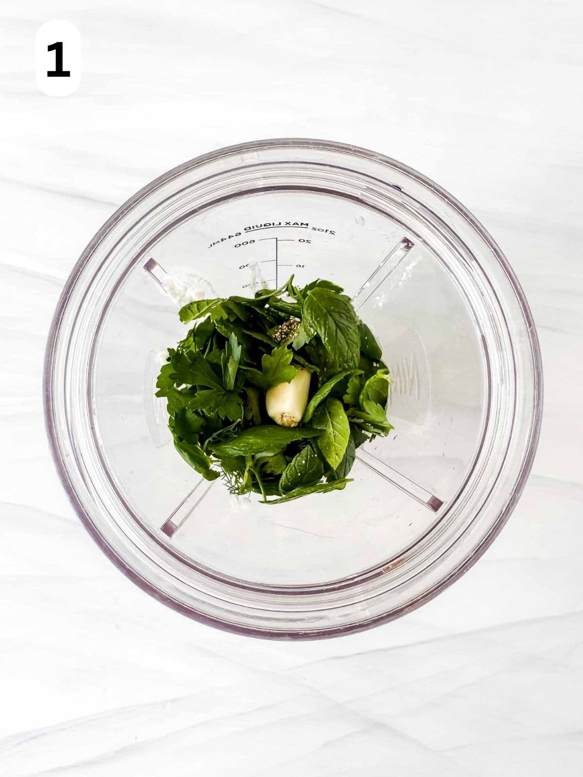 cottage cheese, fresh herbs, garlic and black pepper in a blender cup labelled number one.