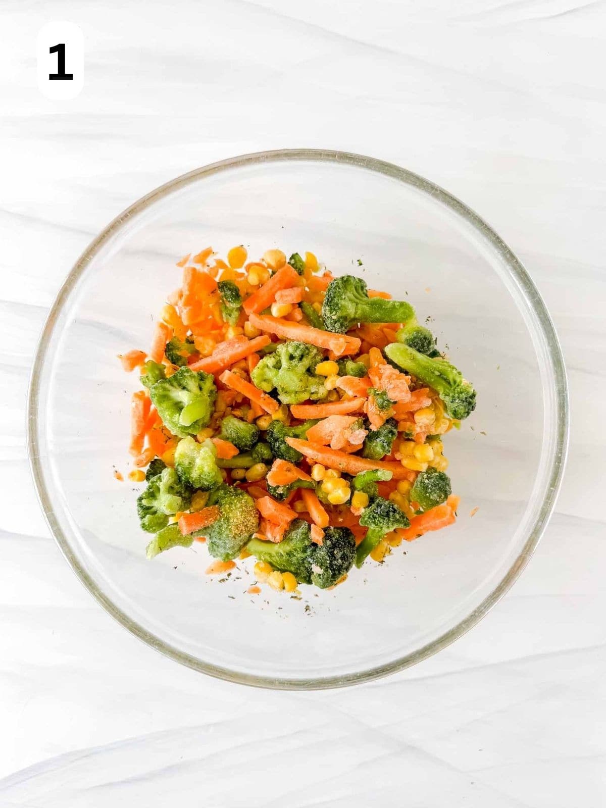 mixed frozen vegetables in a glass bowl labelled number one.