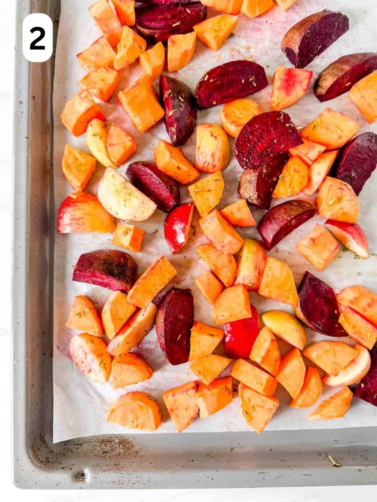 diced sweet potatoes, beets and apple on a baking sheet lined with parchment paper labelled number two.
