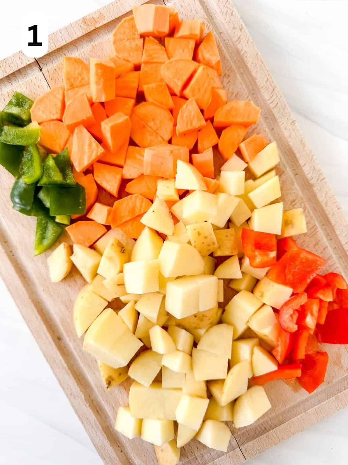 diced sweet potatoes, potatoes, red bell pepper and green bell pepper labelled number one.