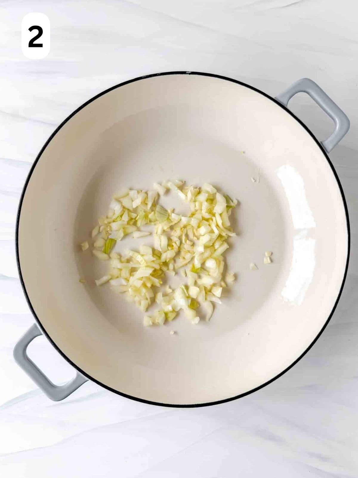 onion and garlic in a skillet labelled number two.