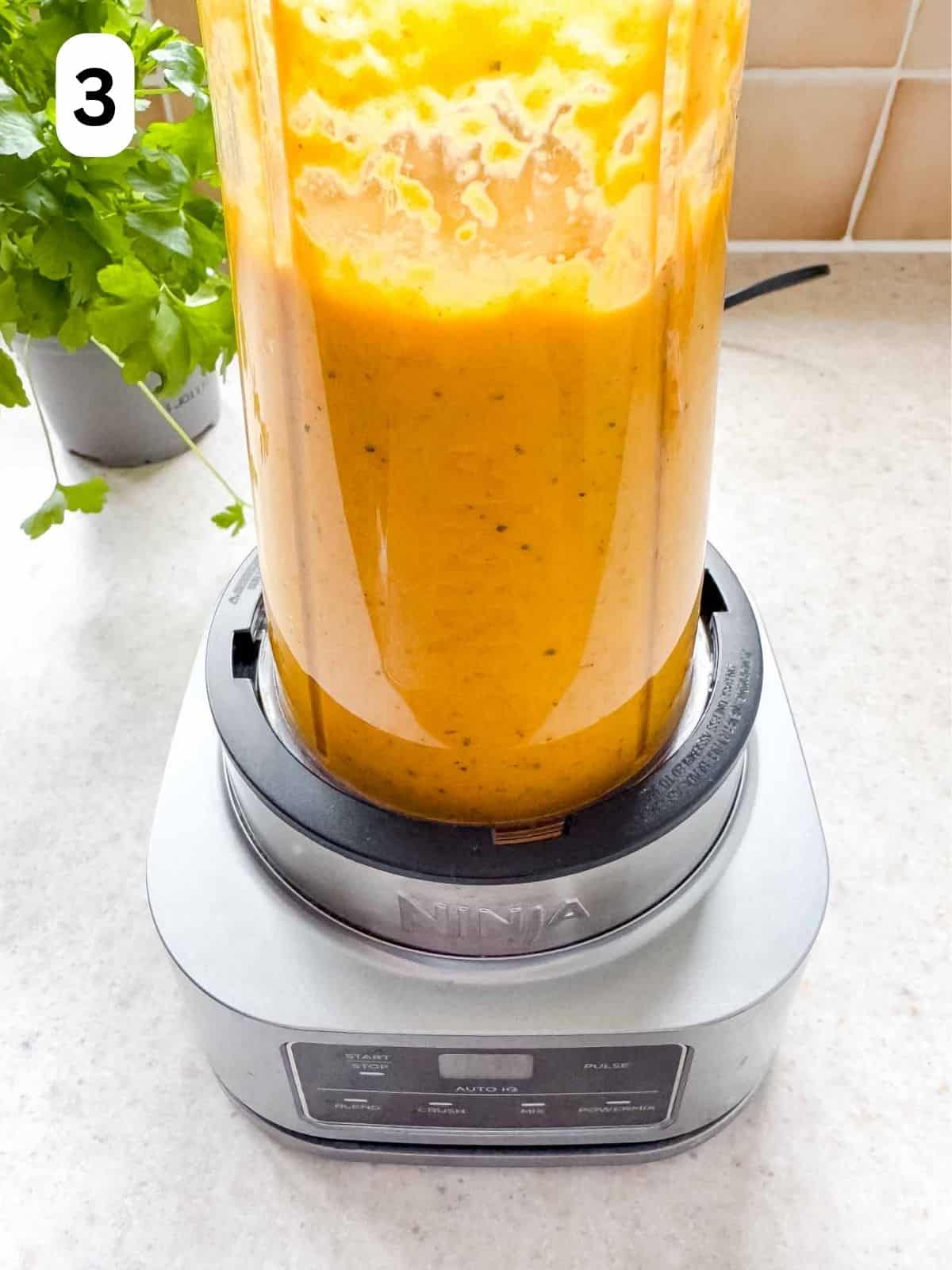 roasted carrot sauce in a blender labelled number three.