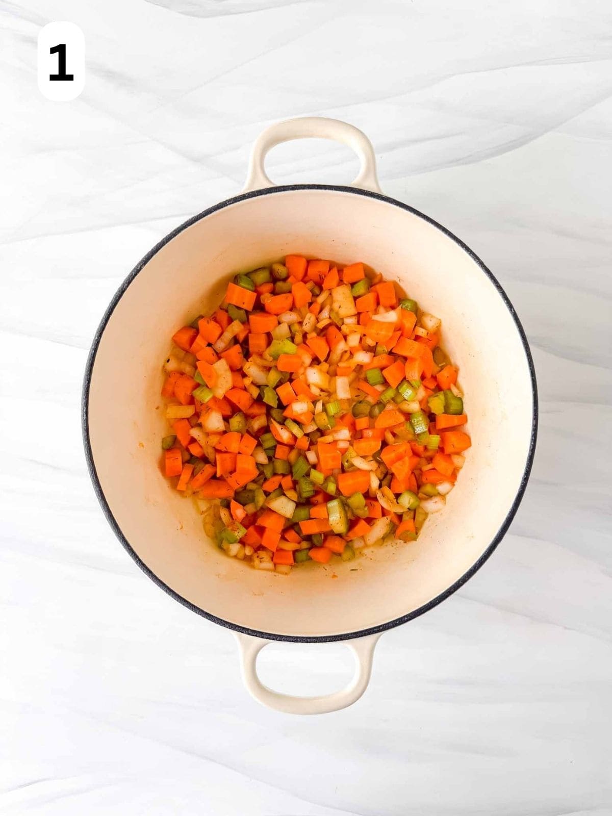 diced carrots, celery and onion in a soup pot labelled number one.
