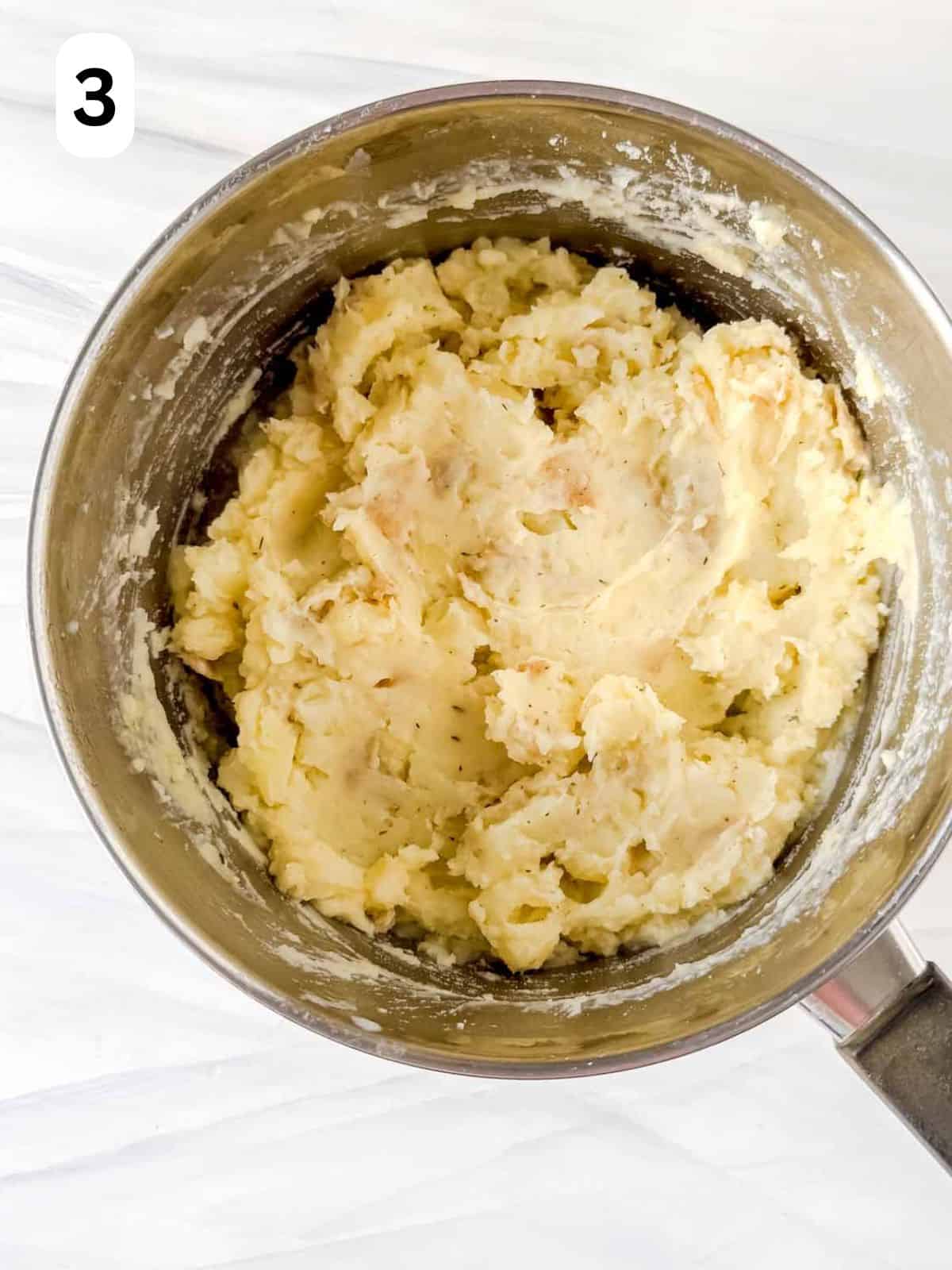 mashed potatoes in a large pot labelled number three.