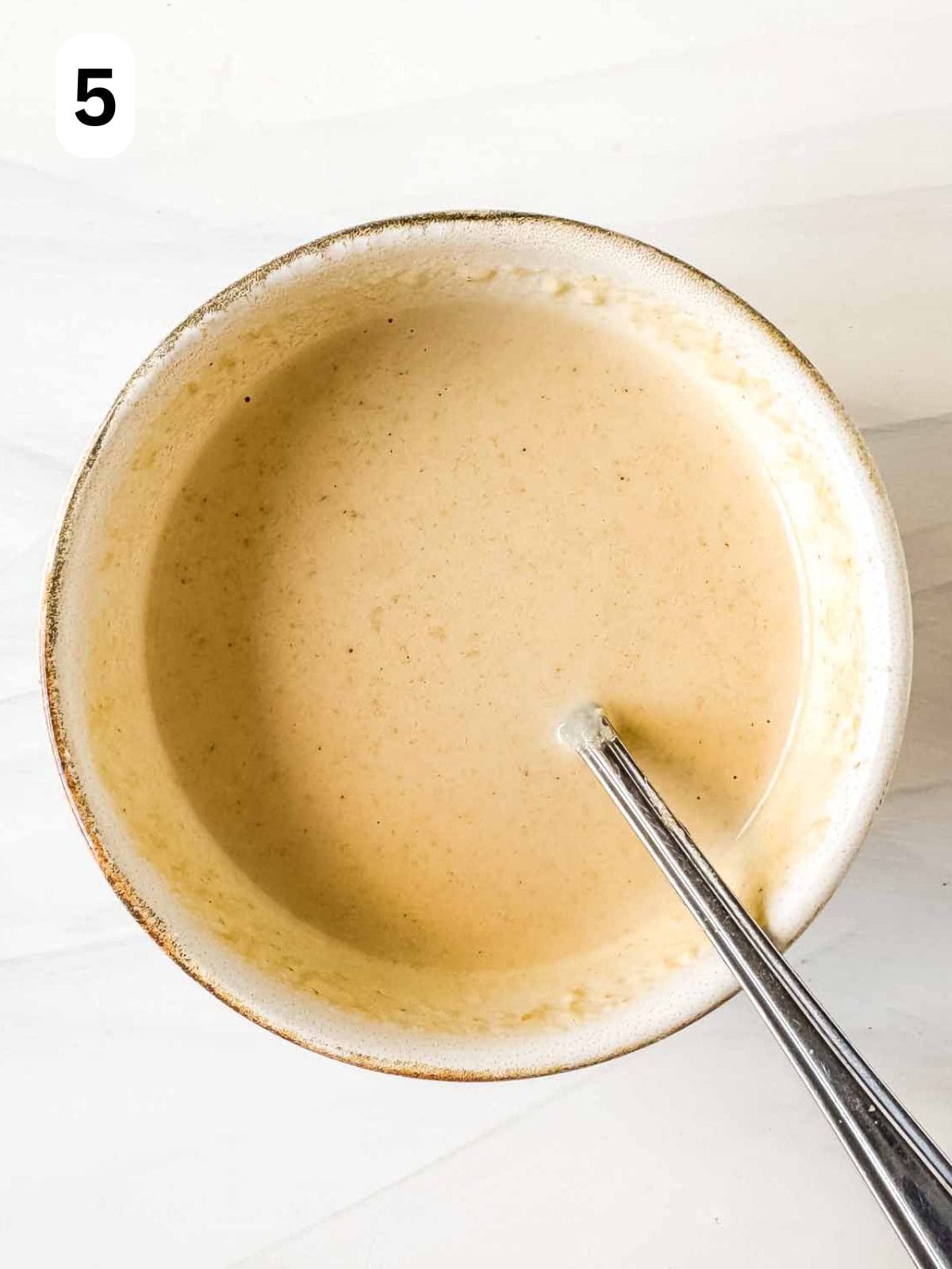 tahini dressing in a bowl labelled number five.