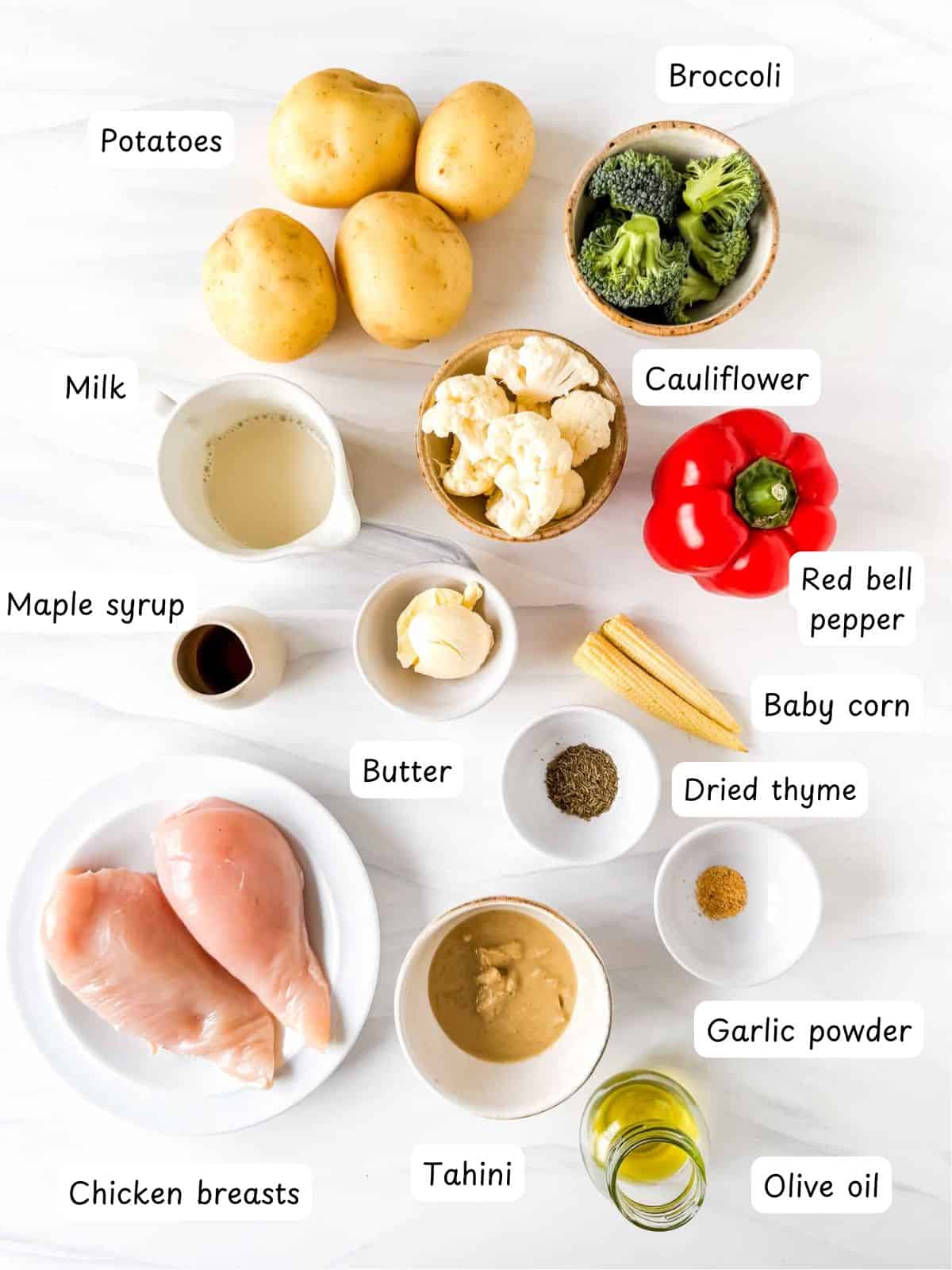 individually labelled potatoes, chicken breasts, broccoli, cauliflower, red bell pepper, milk, maple syrup, butter, baby corn, dried thyme, garlic powder, tahini and olive oil.