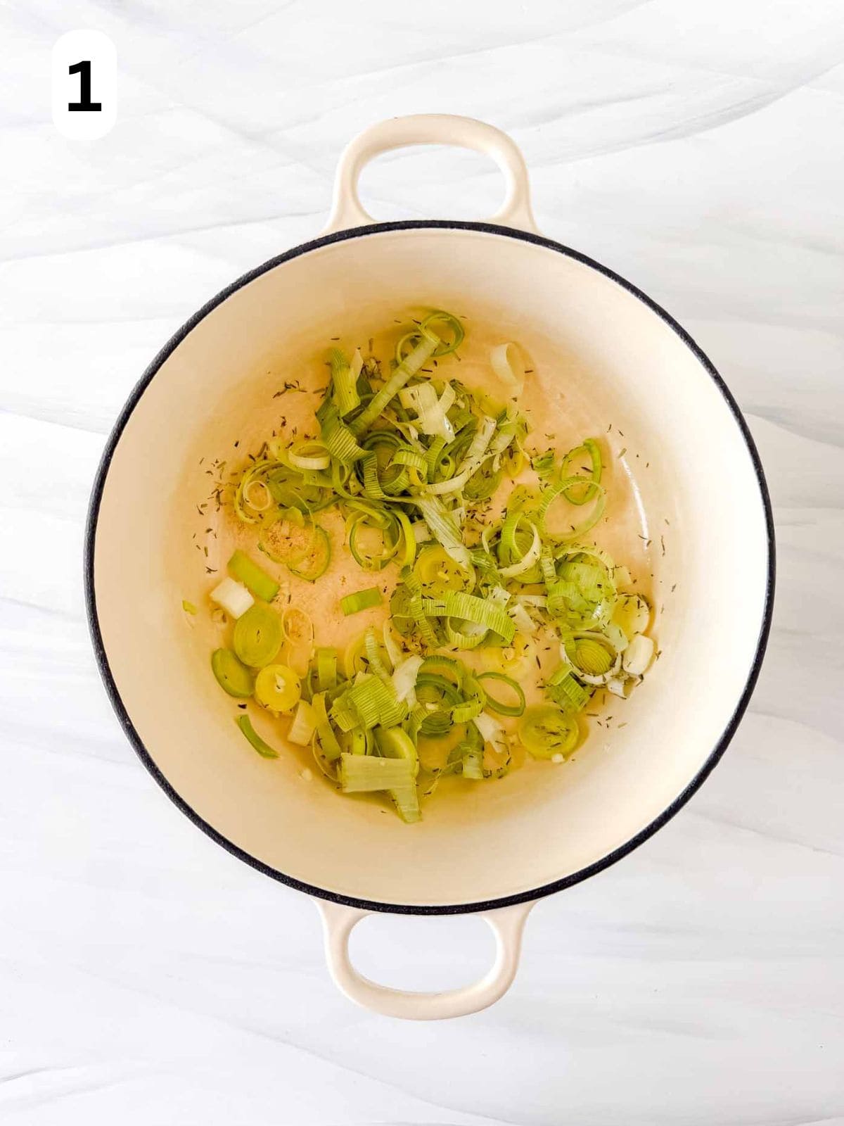 diced leeks and garlic in a Dutch oven labelled number one.