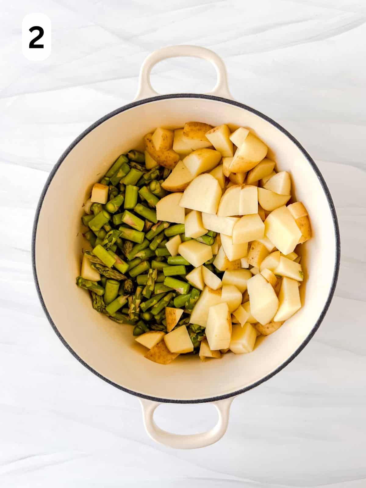 diced asparagus and potatoes in a Dutch oven labelled number two.