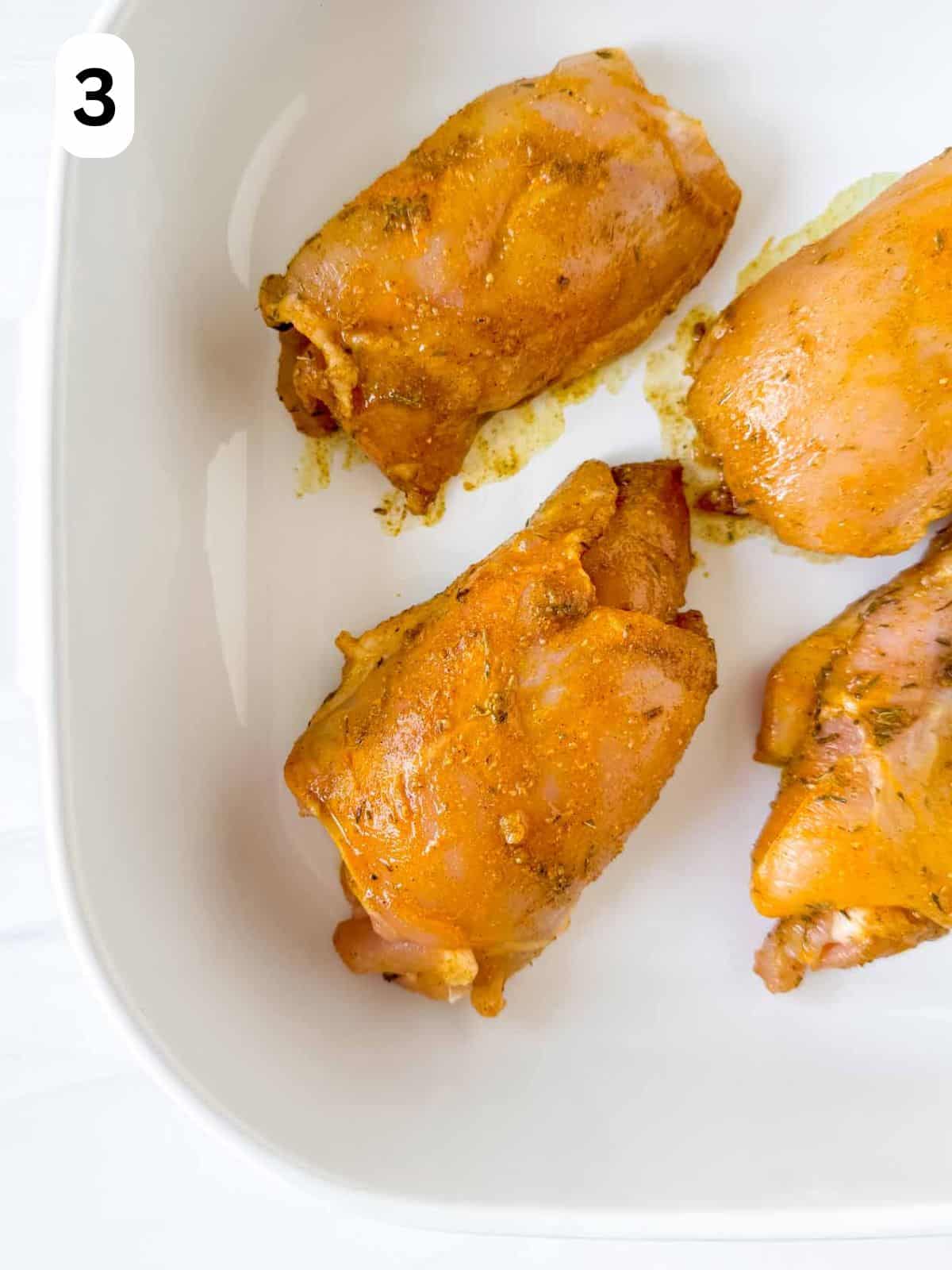 cardamom chicken thighs in an ovenproof dish labelled number three.