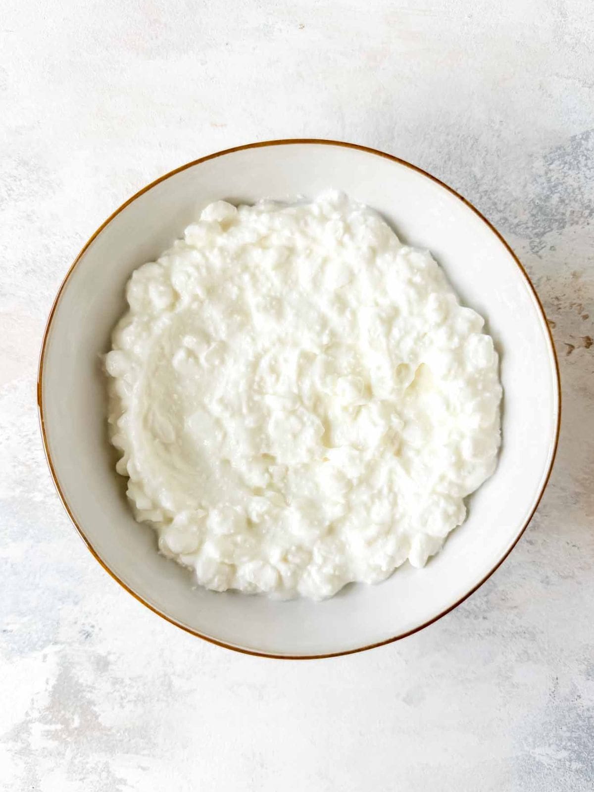 cottage cheese spooned into a white bowl.