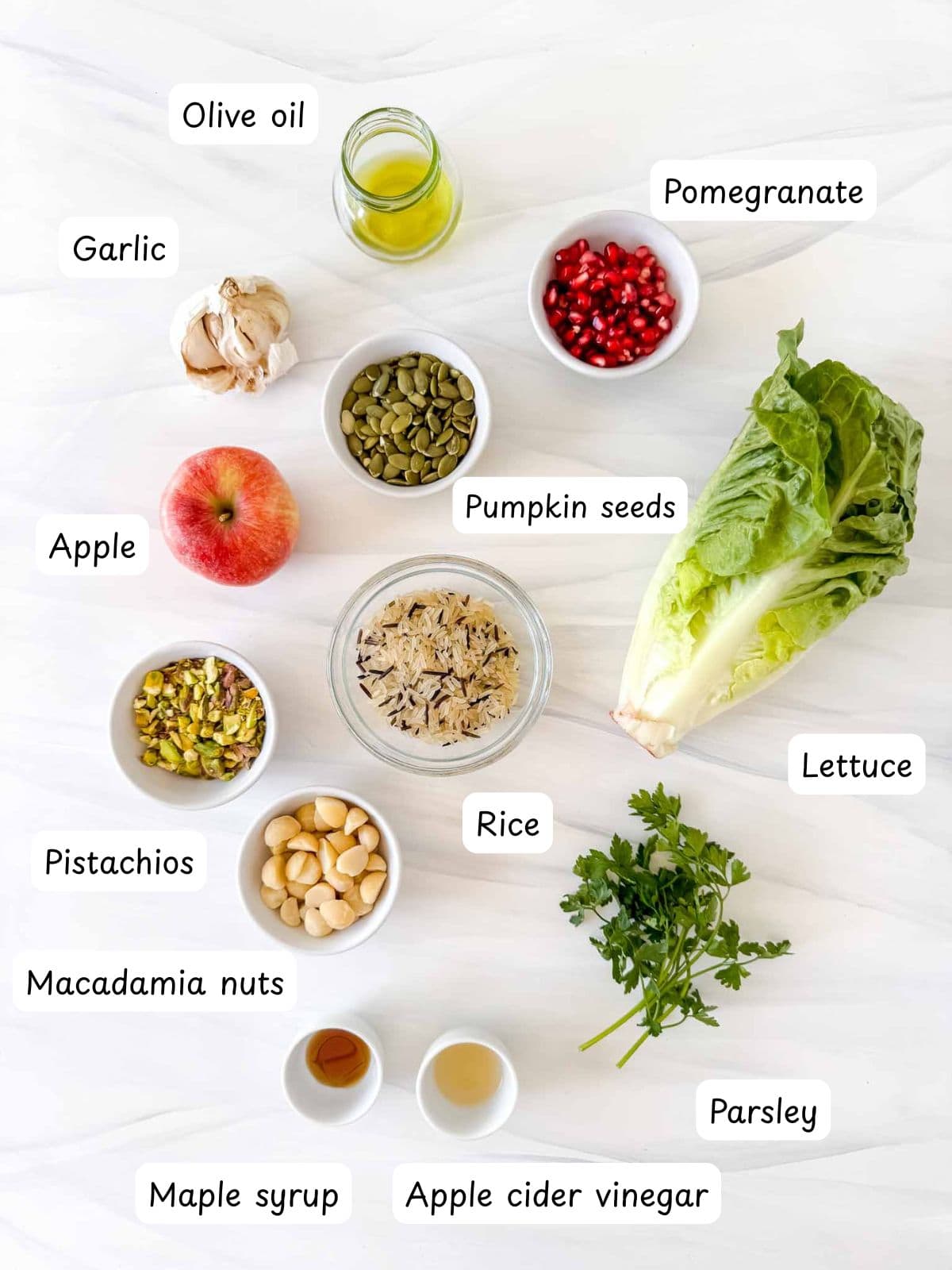 individually labelled olive oil, apple, pomegranate, garlic, rice, lettuce, parsley, pistachios, macadamia nuts, maple syrup, pumpkin seeds and apple cider vinegar.