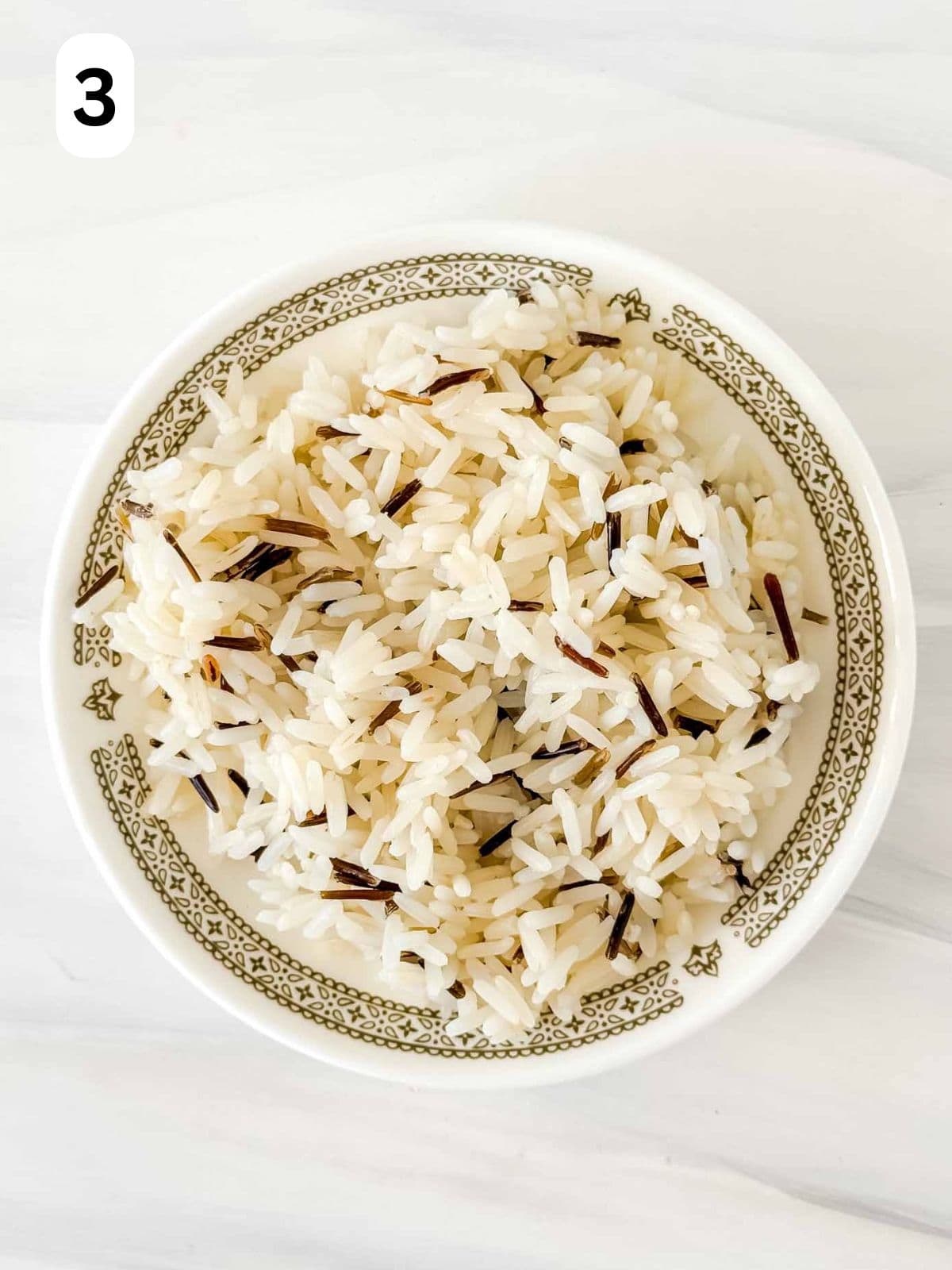 cooked rice on a plate labelled number three.