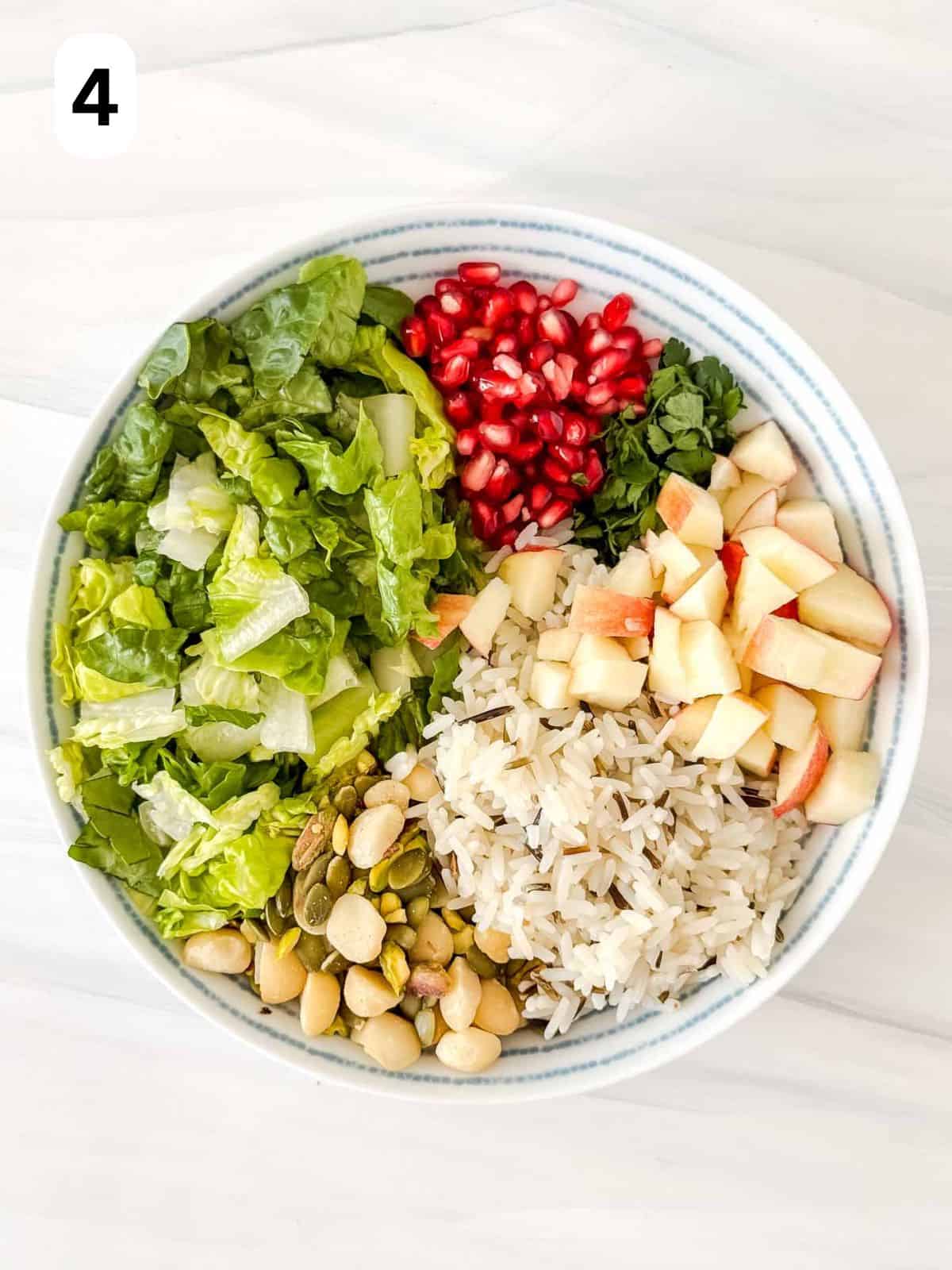 fruits, nuts, rice, nuts and seeds in a bowl labelled number four.