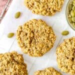 pumpkin seed butter cookies on parchment paper.