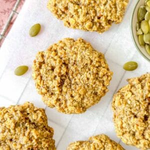 pumpkin seed butter cookies on parchment paper.
