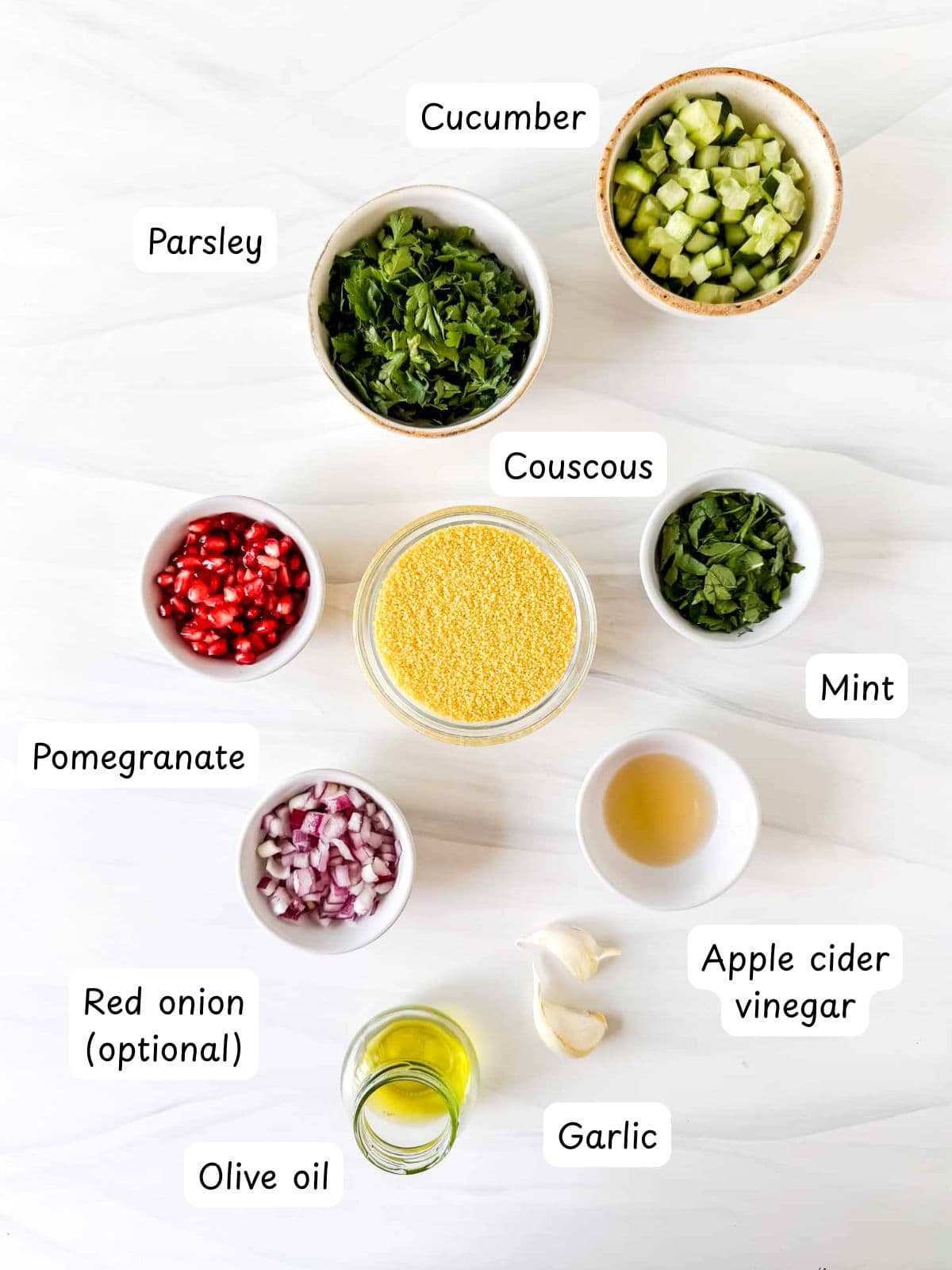 individually labelled couscous, cucumber, parsley, mint, pomegranate, red onion, olive oil, garlic and apple cider vinegar.