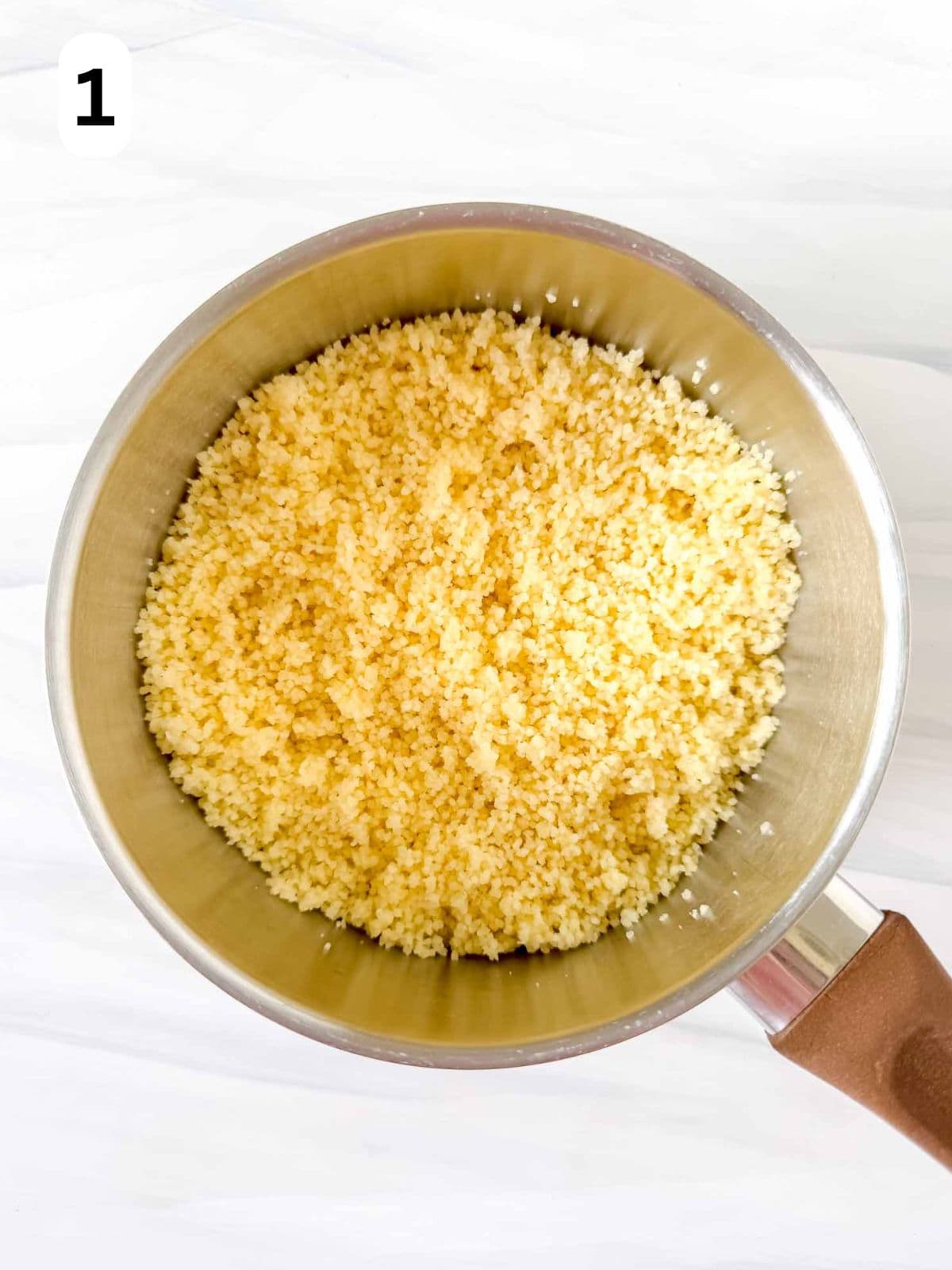cooked couscous in a pot labelled number one.