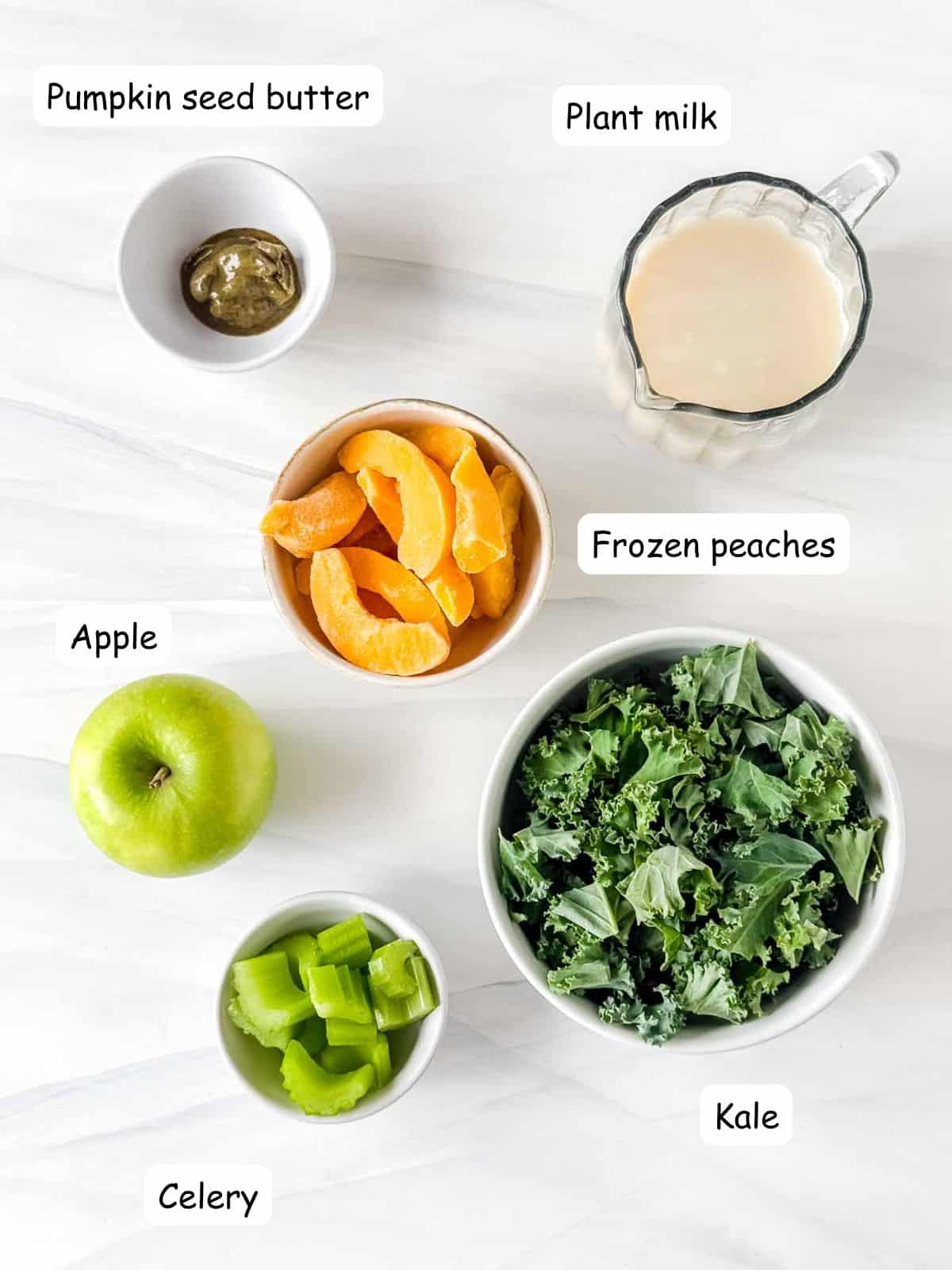 individually labelled frozen peaches, kale, apple, celery, plant milk and pumpkin seed butter.