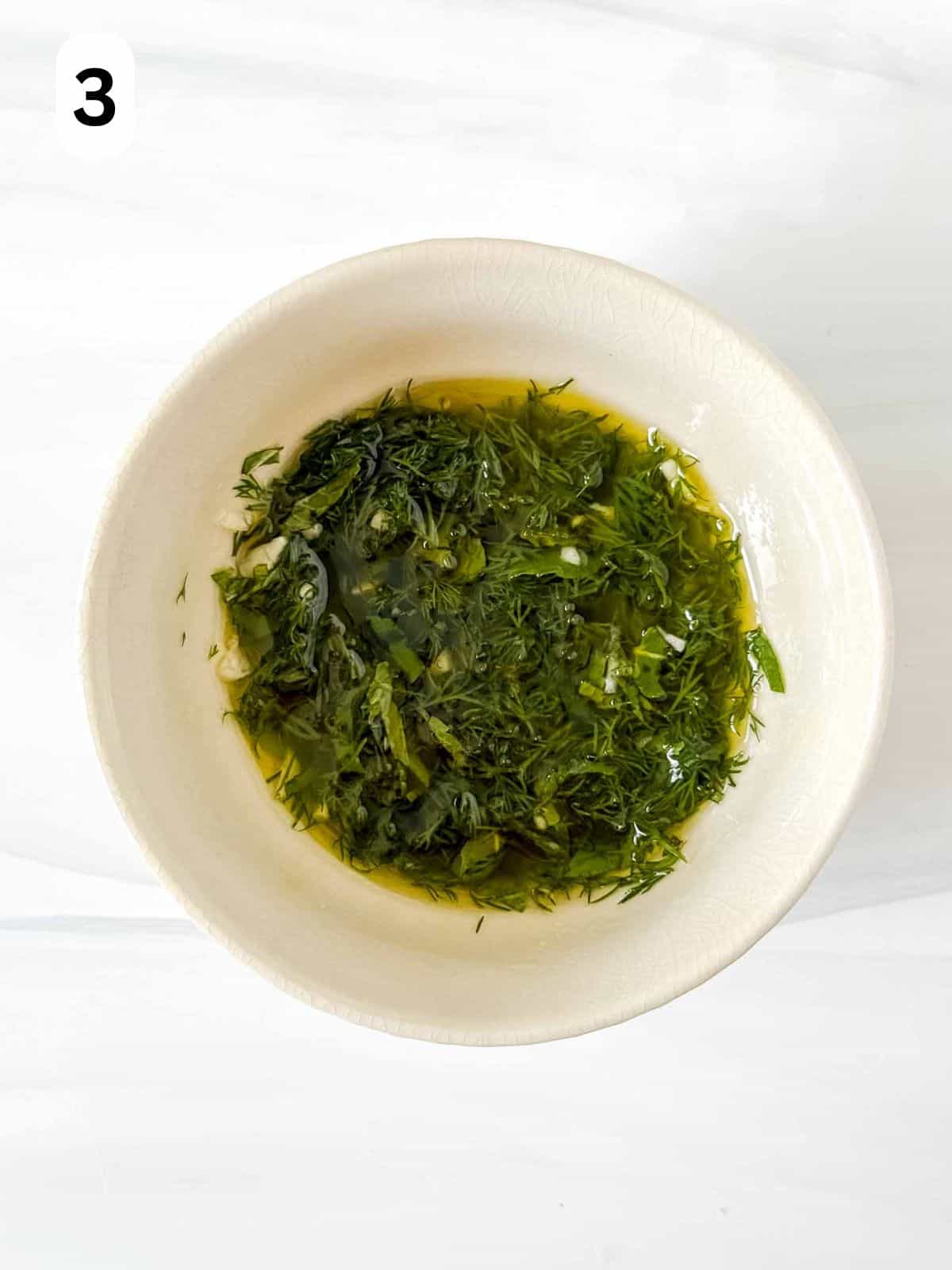 olive oil and diced mint and dill in a small bowl labelled number three.