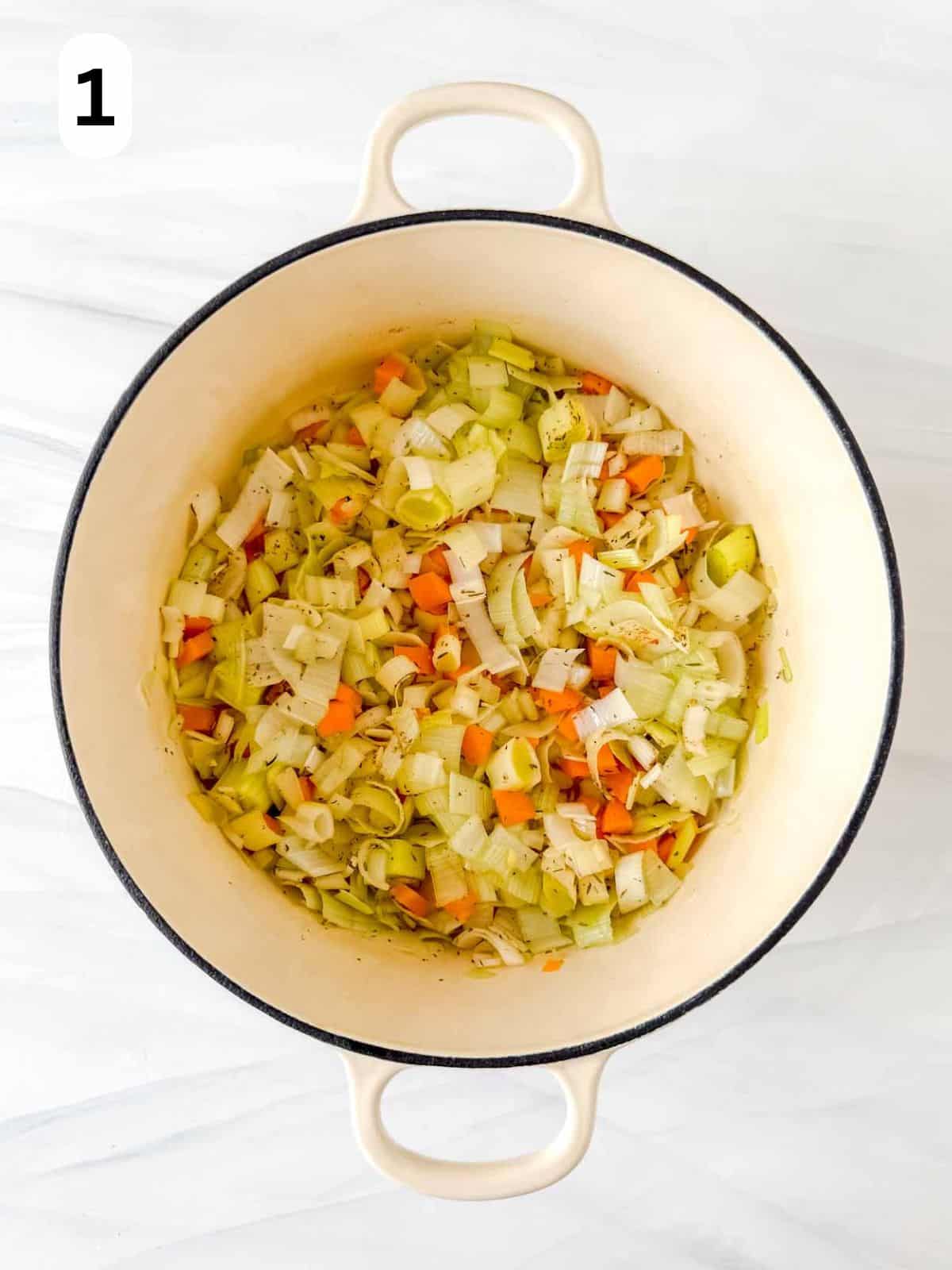 diced leeks, carrot and celery in a soup pot labelled number one.