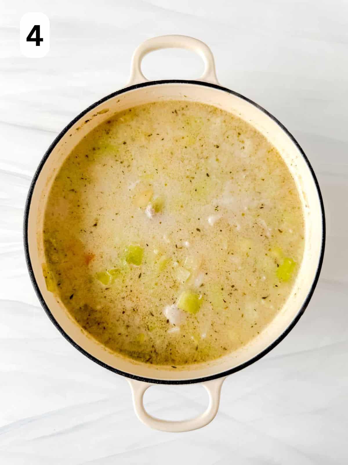 chicken leek potato soup cooking in a soup pot labelled number four.