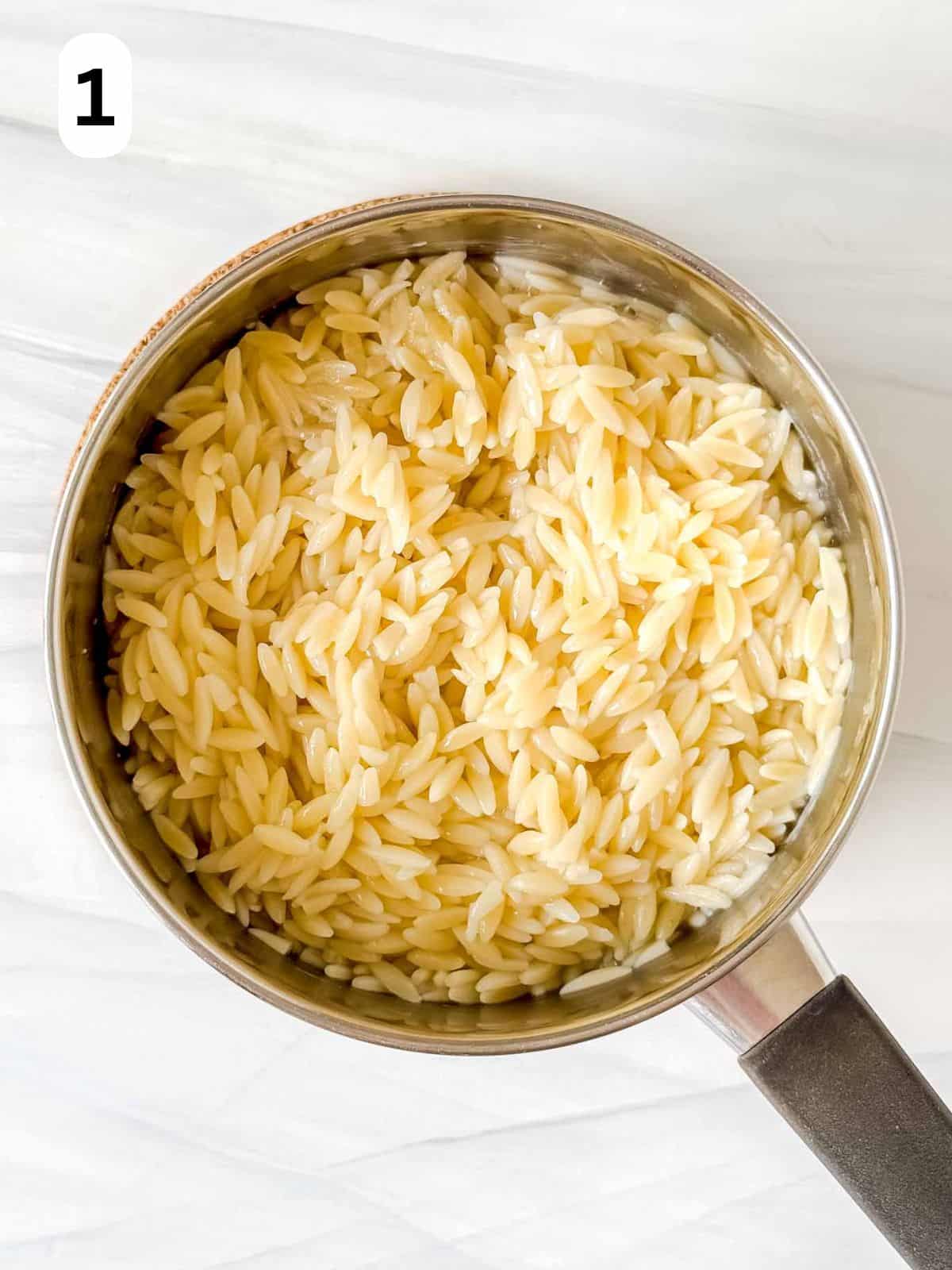 cooked orzo pasta in a pot labelled number one.