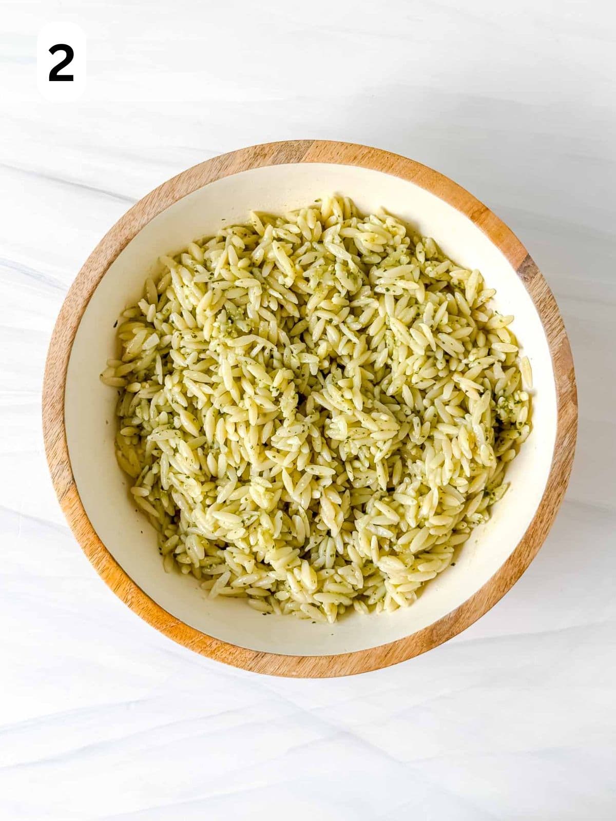 orzo pasta with pesto sauce in a bowl labelled number two.