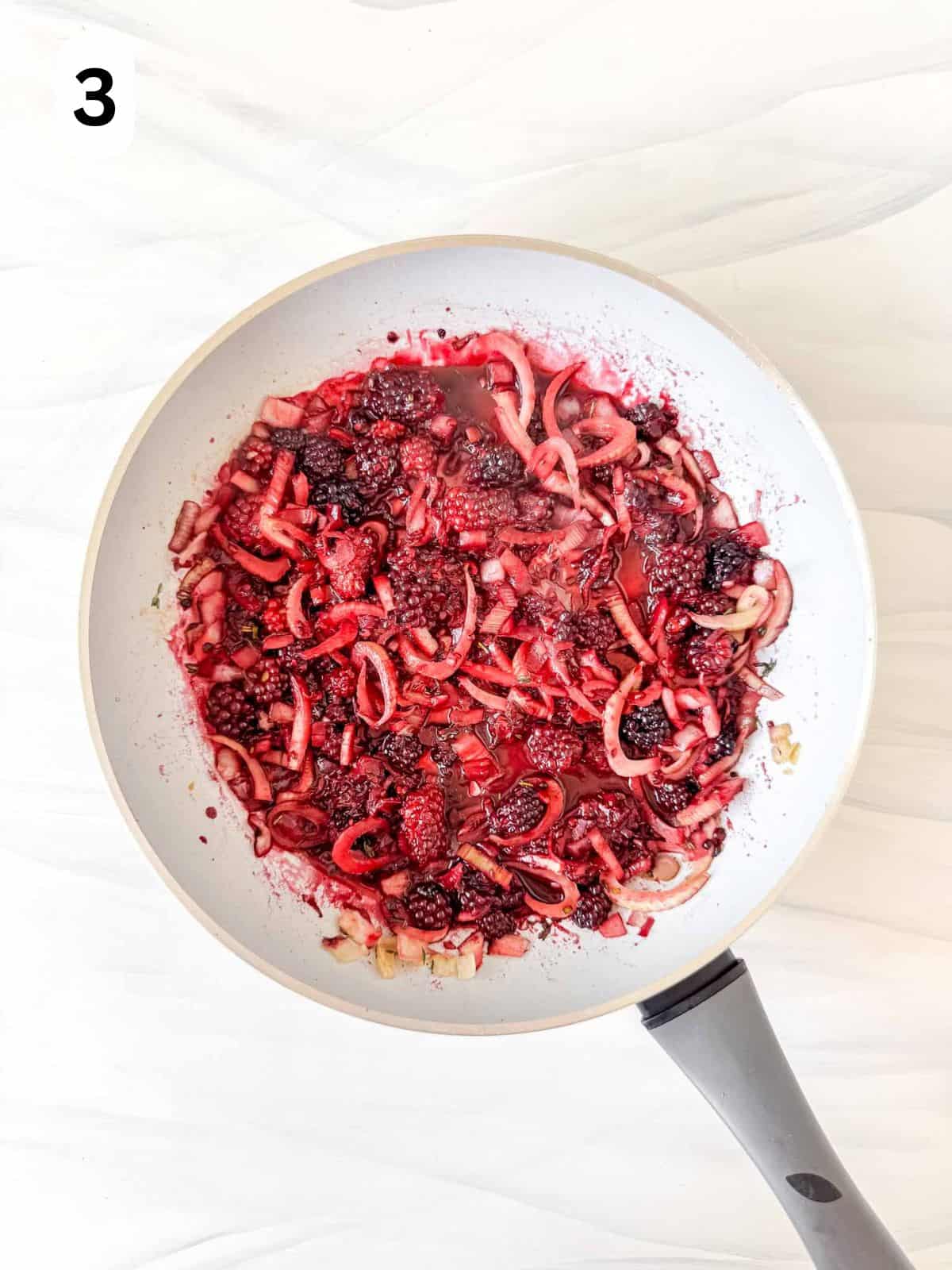 blackberry sauce with fennel, onion and herbs in a skillet labelled number three.