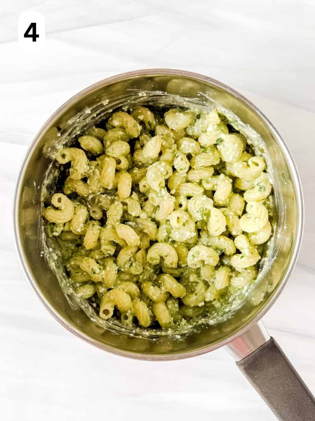 cottage cheese pesto pasta in a pot labelled number four.