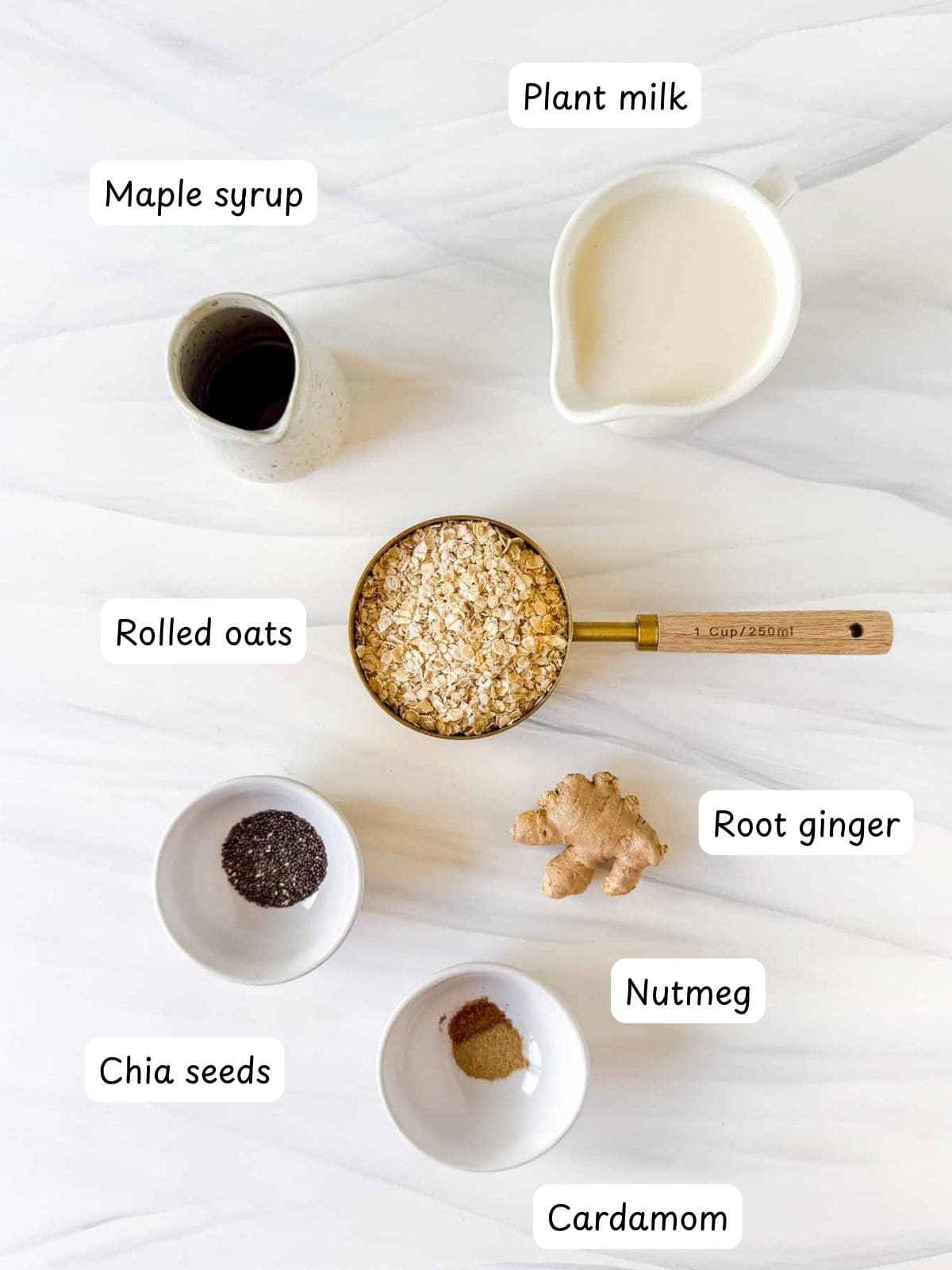 individually labelled oats, root ginger, nutmeg, cardamom, plant milk, maple syrup and chia seeds.