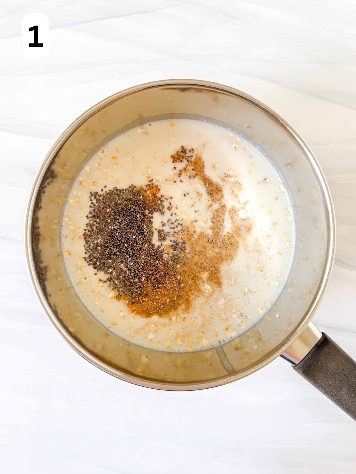 oats, plant milk, chia seeds, grated root ginger, nutmeg and cardamom in a pot labelled number one.